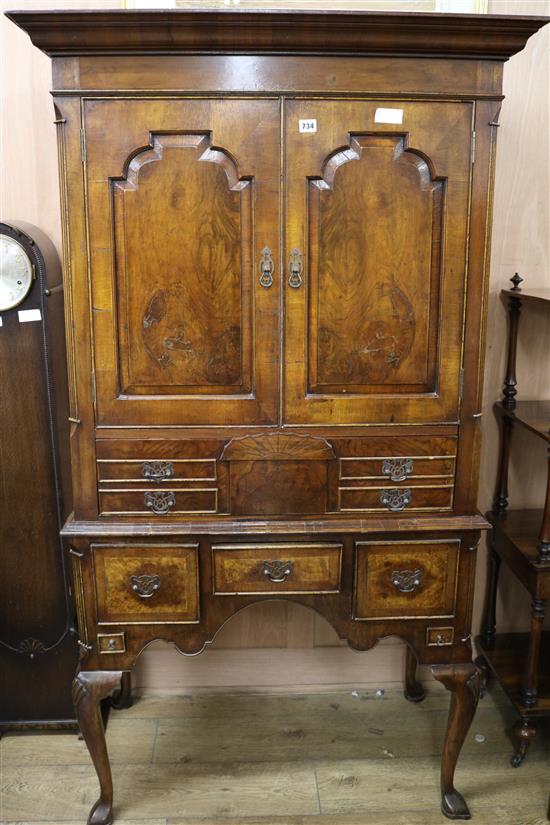 An early 18th century style walnut cabinet on stand, H.173cm